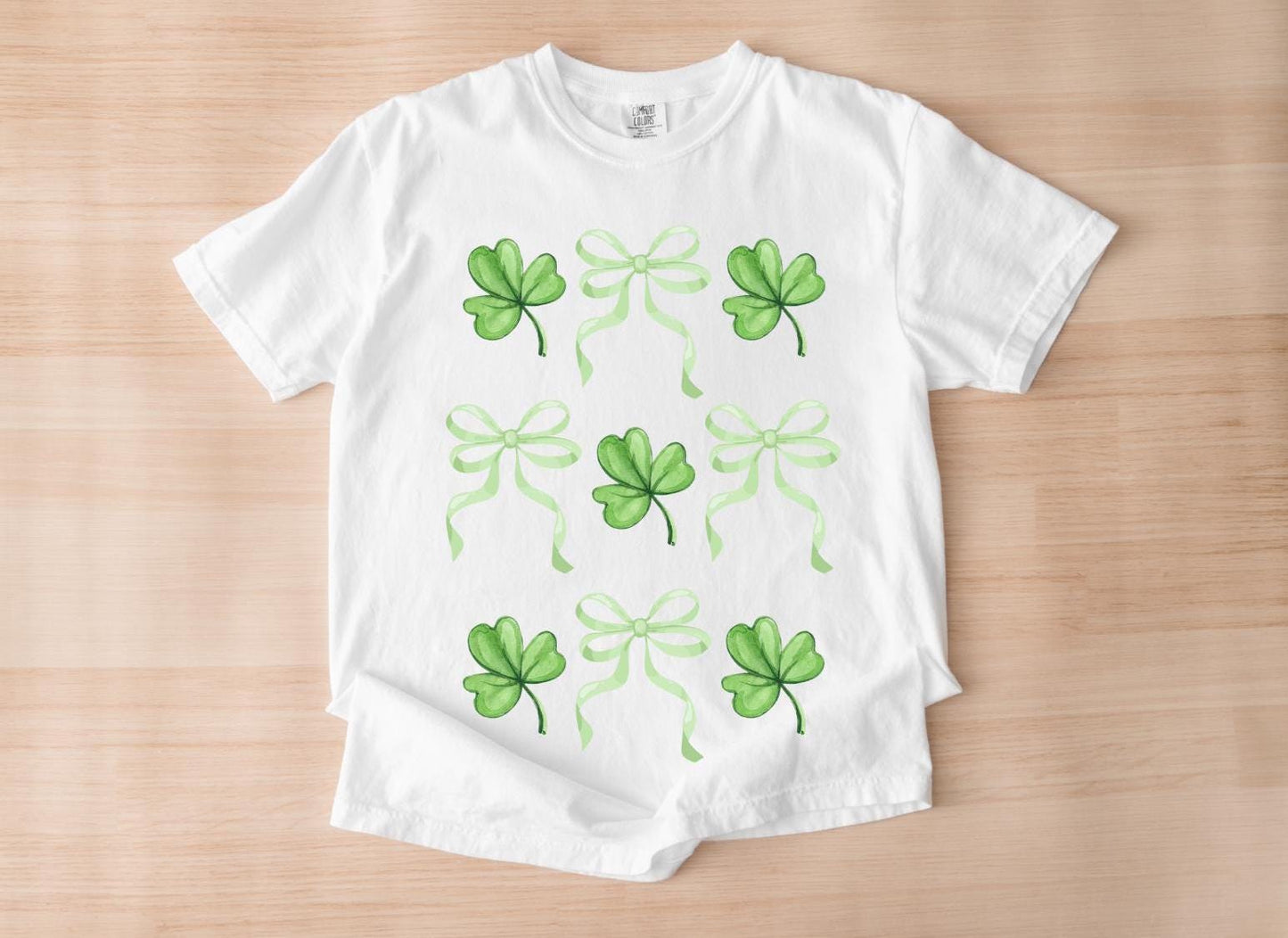 St. Patrick's Day Clover & Bow T-Shirt - Cute Green Shamrock Graphic Tee for Festive and Lucky Vibes!